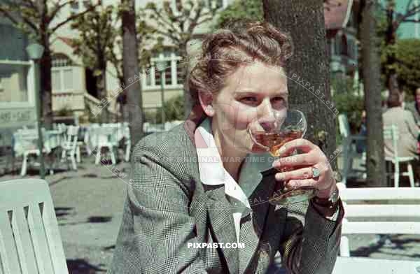 woman having a drink in Travenmunde, Germany 1940