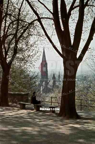 woman on a bench looking over Freiburg, Germany 1939