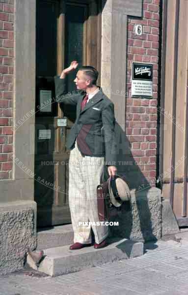 WW2 color Stuttgart Germany 1938 Man hat poster dress costume normal daily life apartment door