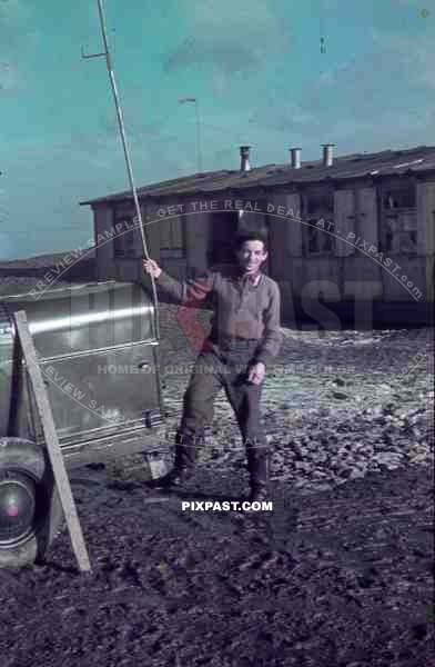 WW2 Colour Photo German Luftwaffe Glider Pilot in flight boots with petrol power generator Lubeck Germany 1943