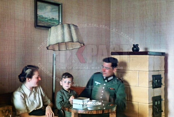 Young Austrian artillery soldier getting leave and visiting his wife and little son. Austria 1944