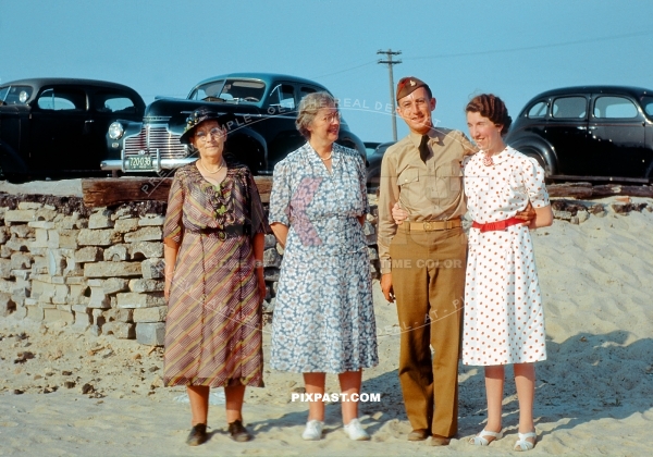 American artillery army officer with his wife, mother and step mother visiting the beach for a day out. California USA 1942