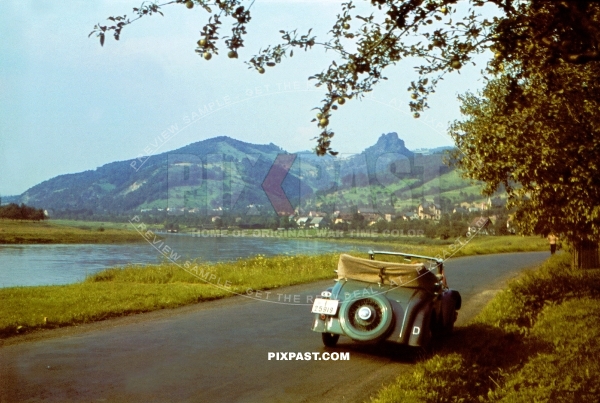 Civilian German Mercedes cabrio racing car in Green. Drive beside The Dresden Elbe Valley. Germany 1938. I-25919