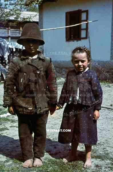 farm children stand to attention for german soldier, Yugoslavia, 1941