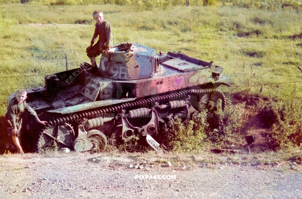 French children playing on abandoned small French Renault AMR 33/35, french light cavalry tank, France, 1940.