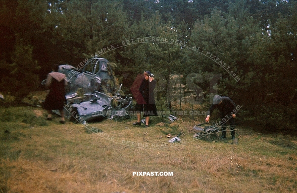 French farmers outside of Paris inspecting a wrecked crashed German Luftwaffe Stuka dive bomber 1940