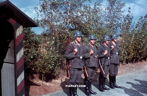 German Luftwaffe air force soldiers parade with Kar98 rifles at security station for RAD bridge repair unit. France 1940