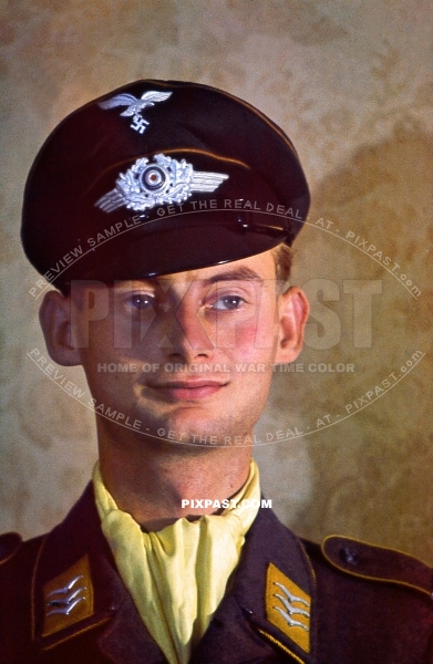 German Luftwaffe Flieger Feldwebel with yellow Collar Tabs. With yellow scarf and pilots air force cap. Germany 1941