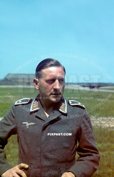 German Luftwaffe Flight  Feldwebel poses in front of airbase and bomber plane. France 1940