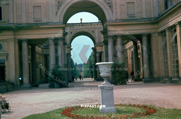 German Luftwaffe soldier saluting women in Potsdam Palace grounds. Germany 1943