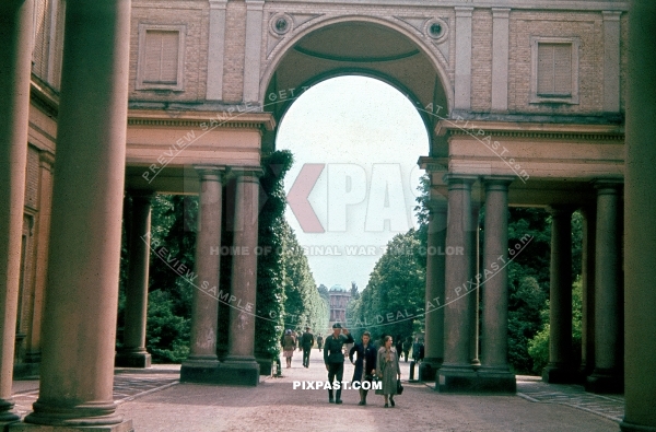 German Luftwaffe soldier saluting women in Potsdam Palace grounds. Germany 1943