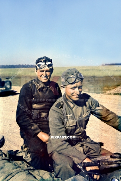 German panzer army commander on the back of a BMW motorbike kradmelder on dusty Russian road. Summer 1942
