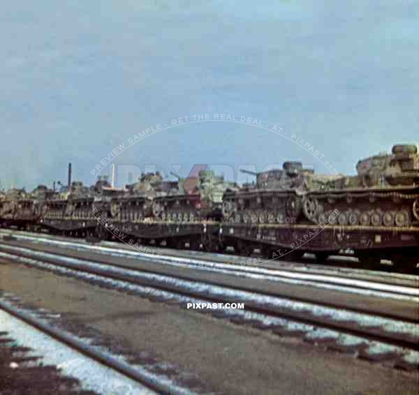 German Panzer Tank 4 in yellow sand camouflage loaded onto train wagons. towards Russian front 1943