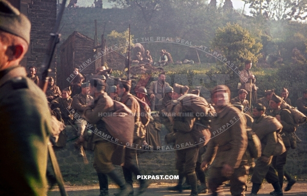 Large quantities of captured French military Prisoner of War. Guarded by German soldiers. France 1940