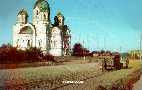 Russian orthodox church near Smolensk summer 1942, German transport truck with soldiers and bicycle