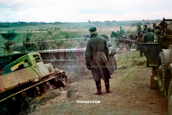 Wehrmacht crossing pontoon bridge. Smolensk 1941. Horch 901 jeep and Russian Komintern 1933 Heavy Artillery Tractor