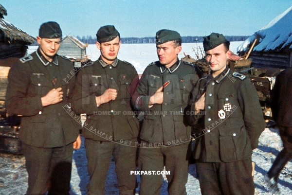 Young German army soldiers wearing OST red ribbon and new awarded iron cross with combat badge. Russia 1942