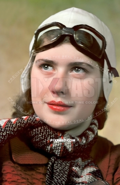Young German woman Berlin 1940 wearing flying / driving goggles and white leather helmet