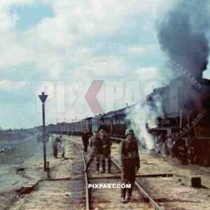 2 Large troop transport Locomotives stopping to let soldiers stretch their legs before continuing to the Eastern Front 1942.