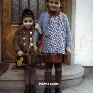 2 girls standing on steps, Germany 1938