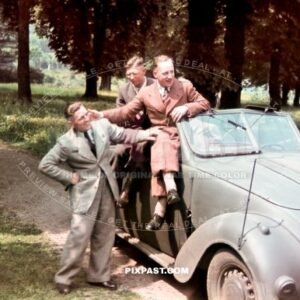 3 young civilian German men sitting on a army feldgrau painted Adler 2.5L Convertible 1937. Germany 1940.