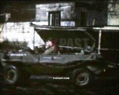 8mm home movie, France 1944, American GI soldier driving captured German Volkswagen Schwimmwagen Jeep.