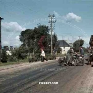 94. Infantry Division Radio Funker Signals Unit install telephone lines in french village, France 1940.