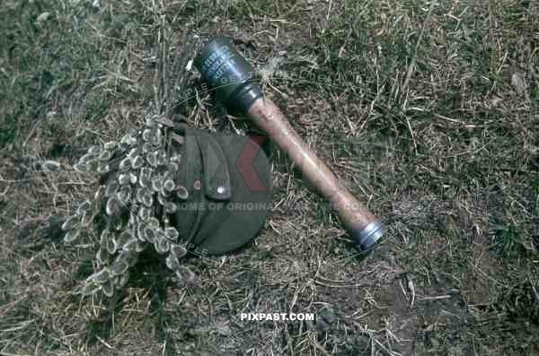 A German soldier photographs his weapons. Polish Russian border Spring  1944.
