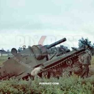 A captured Soviet Russian KV 2 Bunker Buster Heavy Assault Tank. Russian Front 1941. Being inspected by German soldiers.