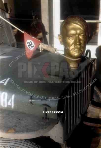 Adolf Hitler statue head bolted to front of American Willi Jeep as war trophy, Heidelberg Germany 1945. 101st Cavalry Regiment.