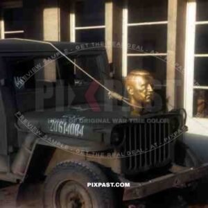Adolf Hitler statue head bolted to front of American Willi Jeep as   war trophy, Heidelberg Germany 1945. 101st Cavalry Regiment.