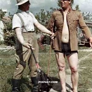 Afrika Korp officers joke around with captured Italian officer uniform, North Africa 1942