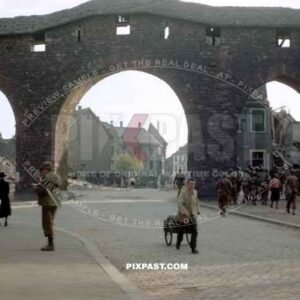 American GI soldiers in Worms Germany 1945. City wall in background.