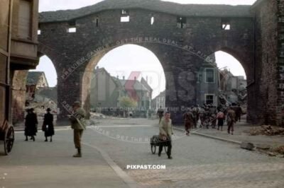 American GI soldiers in Worms Germany 1945. City wall in background.