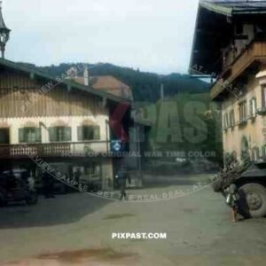 American armoured cars of the 101st Cavalry Regiment park opposite SS troops in Kossen Austria 1945.
