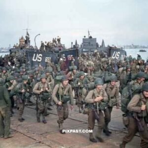 American infantry GIs unloaded from landing craft. Omaha Beach Normandy France. D-Day plus 4 1944
