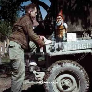 American soldier with german garden gnome. SS Childrens School in Buchenwald Germany 1945.