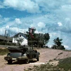 An der Rollbahn, Juli 1941, 94. Infantry Division, Russia. Staff Car and Half track with heavy artillery.
