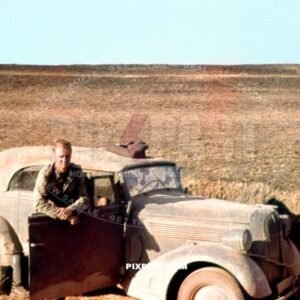 Army driver in his 1938 Opel Super 6 Cabriolet staff car in a Russian field near Stalingrad 1941. 297 Infantry Division
