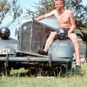 Army driver with his 1938 Opel Super 6 Cabriolet staff car in Russian field. Russia 1941. 297 Infantry Division. W-4246.