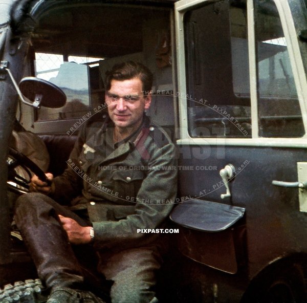 Army medical driver with blue shoulder boards sitting inside a leichter Lkw Steyr 640 - Kfz.70. Sevastopol KRIM Russia 1942
