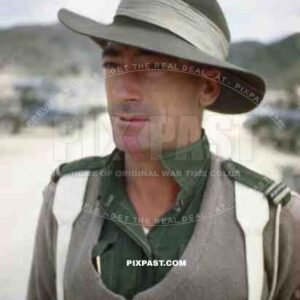 Australian Military Police man standing on the beaches of Sakishima 1945. Delivering some fresh Japanese POWs.