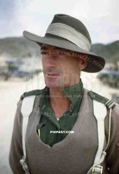 Australian Military Police man standing on the beaches of Sakishima 1945. Delivering some fresh Japanese POWs.