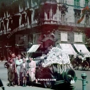 Austrian Family wedding beside vintage car decorated in flowers. Stephansplatz  Vienna, Austria 1938