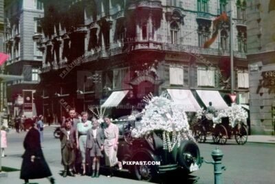 Austrian Family wedding beside vintage car decorated in flowers. Stephansplatz  Vienna, Austria 1938