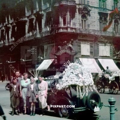 Austrian Family wedding beside vintage car decorated in flowers. Stephansplatz Vienna, Austria 1938