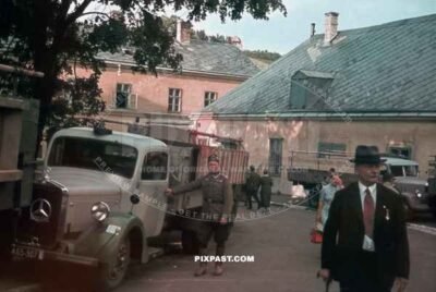Austrian Wehrmacht soldier beside his civilian Mercedes Diesel Truck in Vienna Austria 1939.