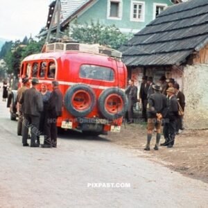 Austrian farmers getting ready to board a red Deutsche Reichspost bus. Austrian village 1939 Klagenfurt am Worthersee