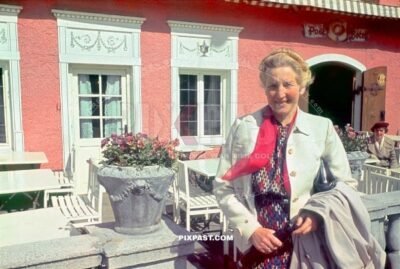 Bavarian German mother in front of Atlas Posthotel Hotel in Marienplatz Garmisch Partenkirchen. Germany 1939