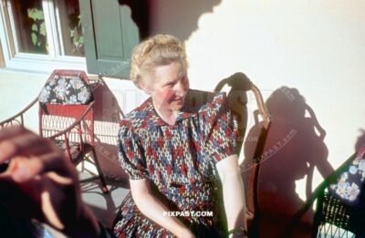 Bavarian German mother in front of Atlas Posthotel Hotel in Marienplatz Garmisch Partenkirchen. Germany 1939